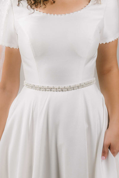 This is a pearl bridal belt that will help accessorize a wedding gown.