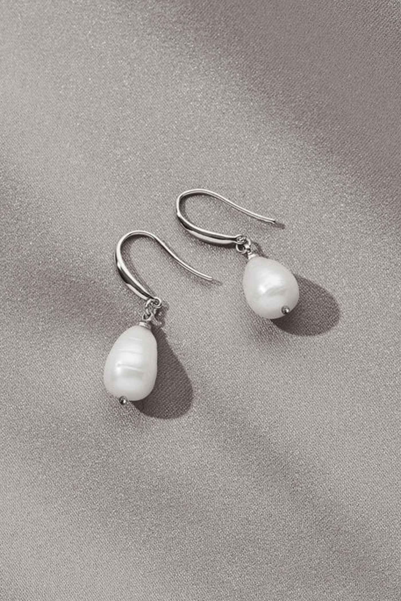 This is a basic shot of pearl drop earrings, perfect for a bride.