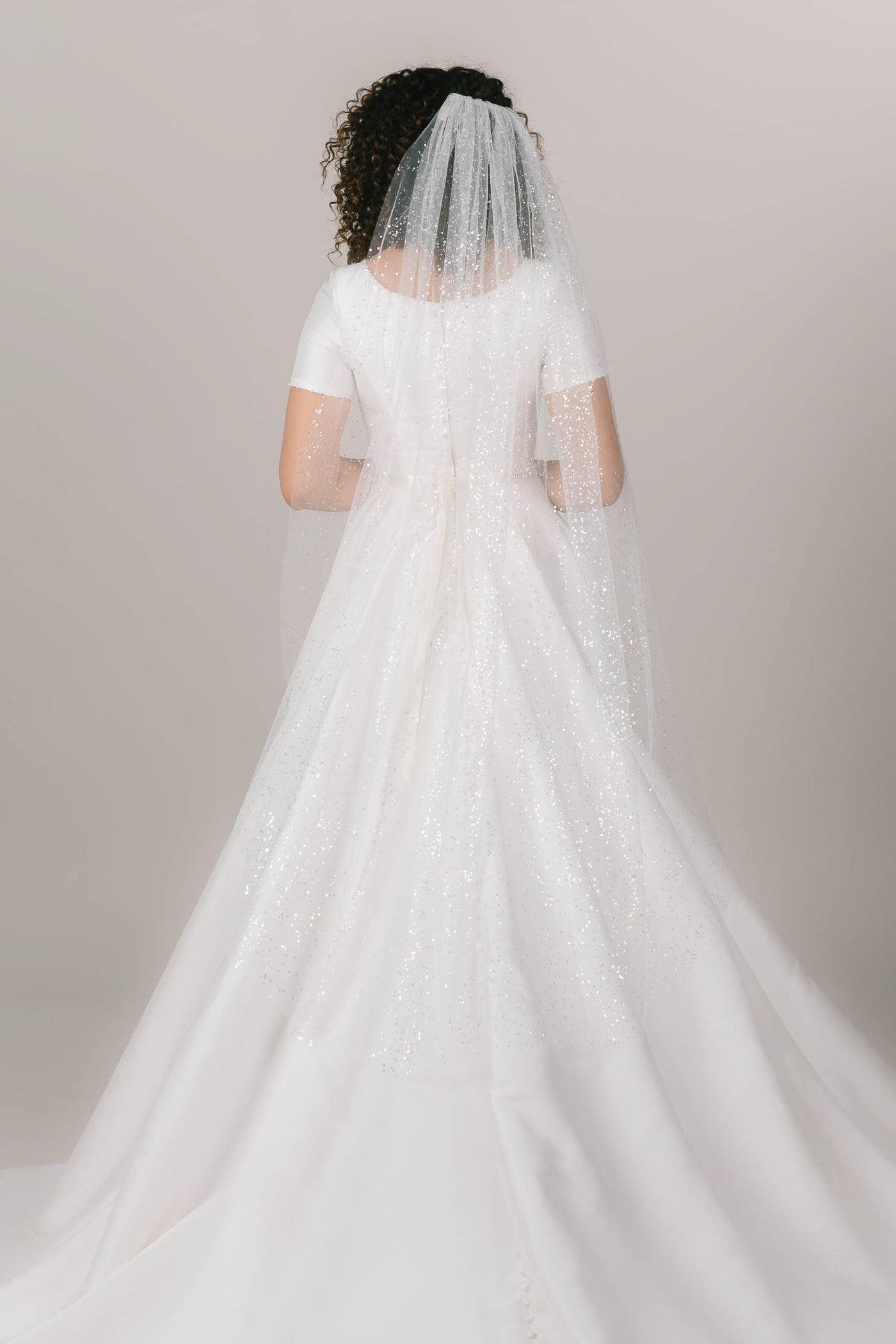 This is a bridal veil with sparkly sequins.