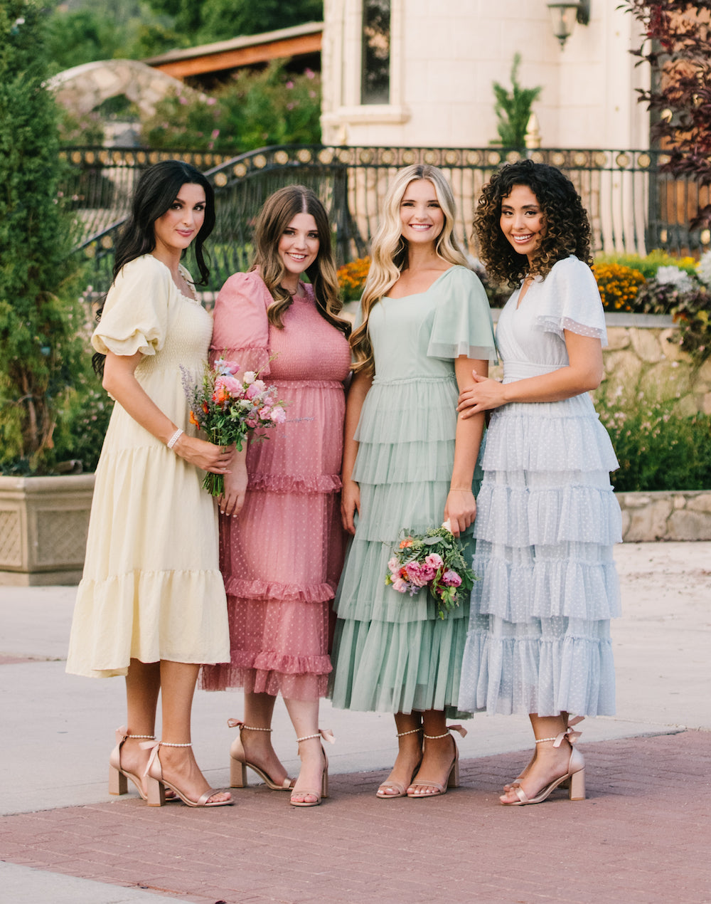 Four girls wearing modest dresses, modest bridesmaid dresses, modest prom dresses and modest clothing