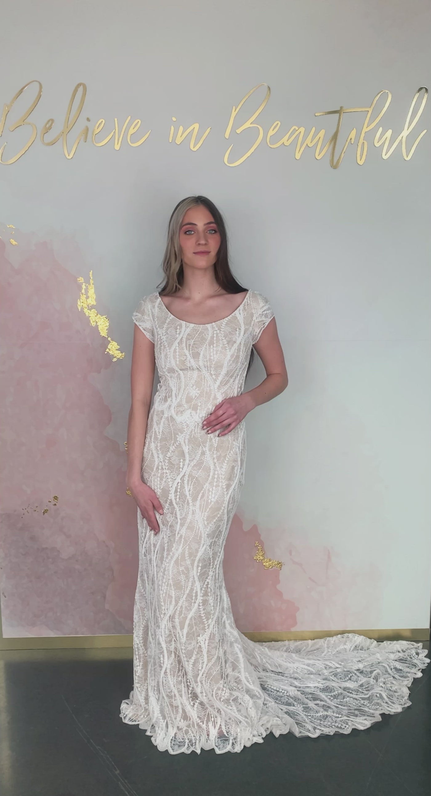 A video featuring our Atlantis wedding dress with its swirly, beaded lace detailing and wide scoop neckline.