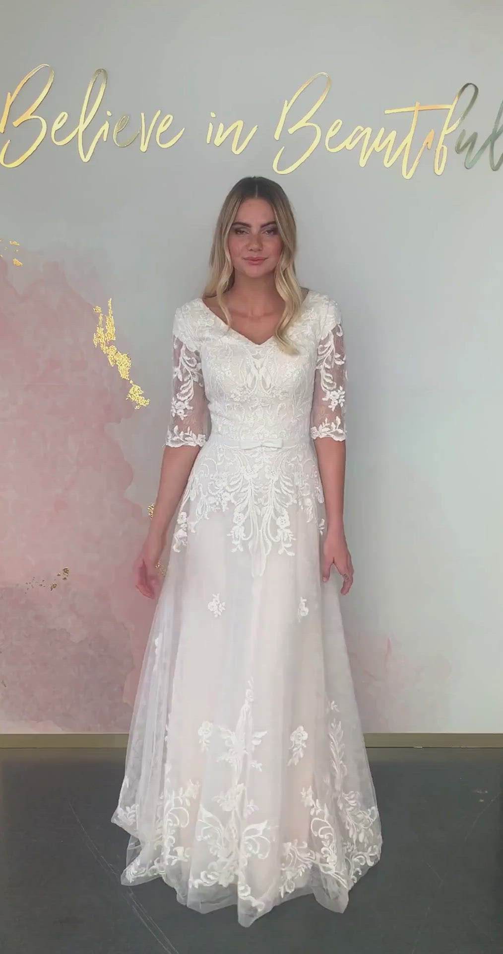A video featuring our Alice wedding dress and its beautiful A-line silhouette, lace applique detailing, and dainty bow at the waist.