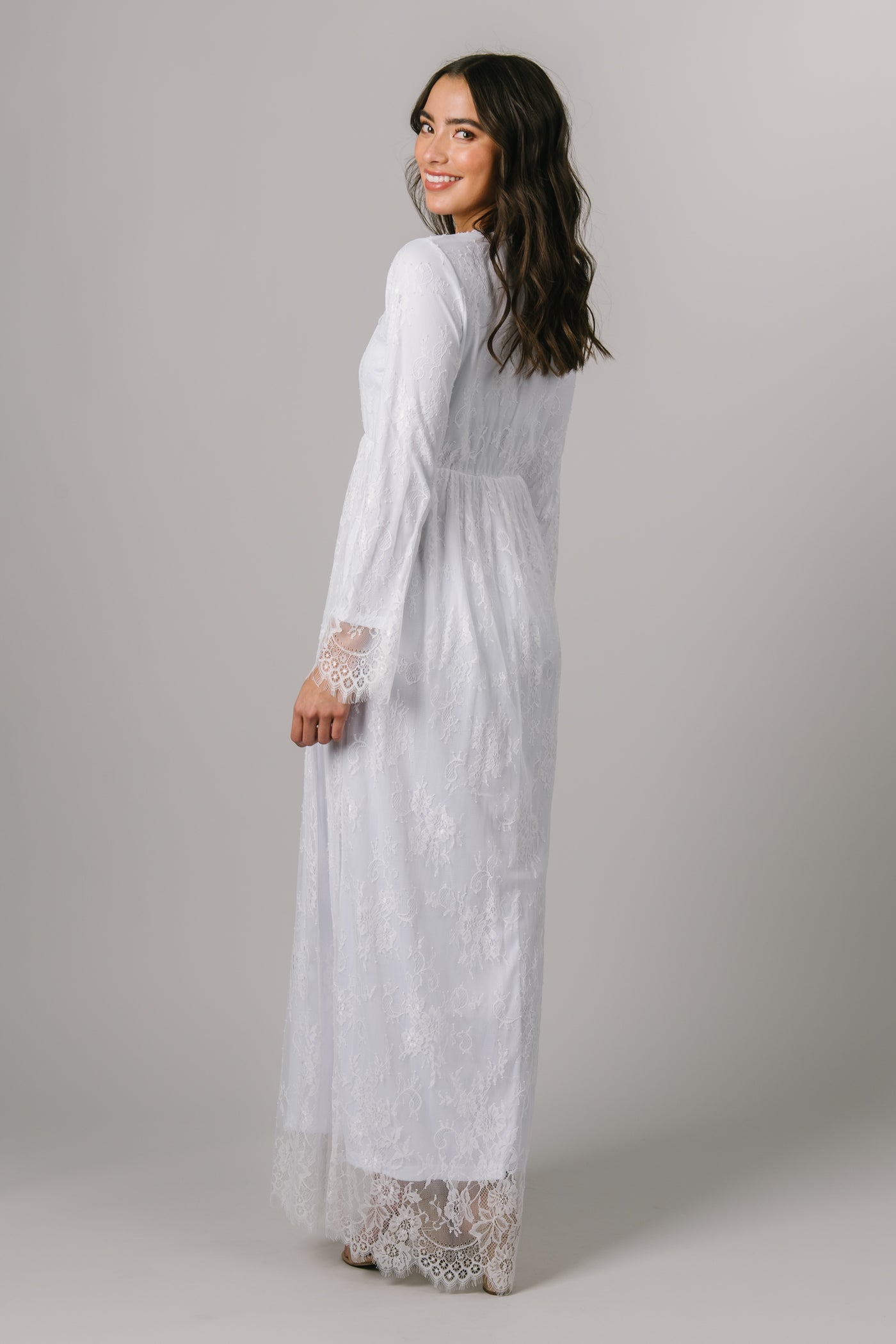 This Modest Temple dress features an all over lace pattern with an overhang of lace on the sleeves and hem! - Modest Temple Dresses - Modest Dresses - Temple Dresses