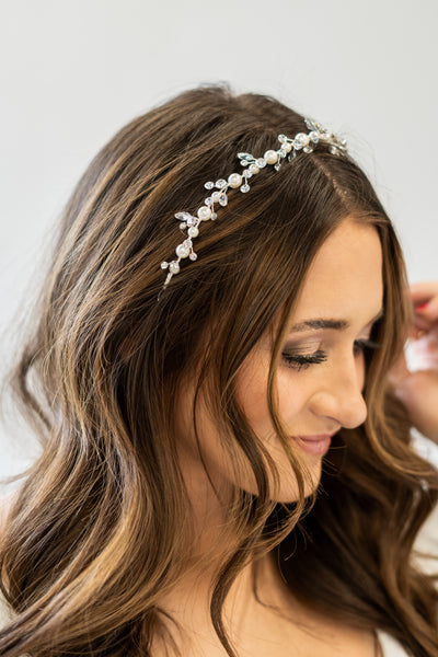 A close up shot of a headpiece that has alternating pearls and crystals to complete your wedding look