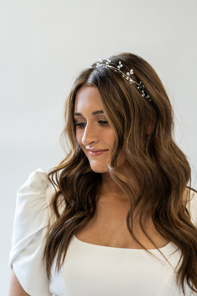 Another angle of the pearl headpiece with delicate floral accents and a gold band to complete your wedding look.