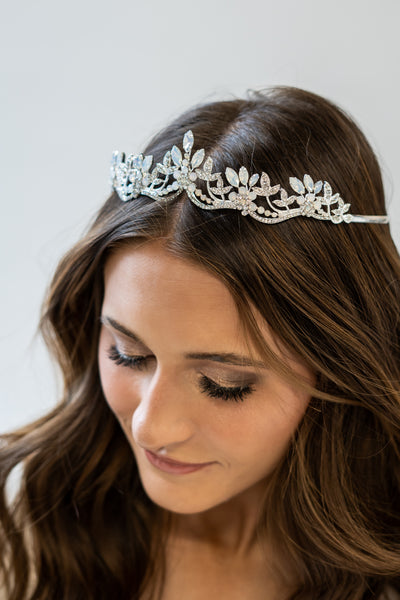 A beautifully silver beaded tiara with diamonds and opals that make you look and feel like a princess.