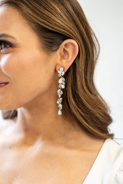 The perfect long dangle crystal and opal earrings to compliment any wedding dress.
