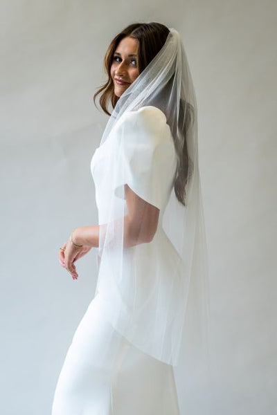 The perfect simple, fingertip length veil with soft English tool, perfect for completing any bridal look.