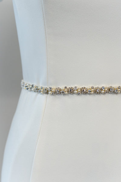 Silver beaded and pearl belt perfect to accessorize your modest wedding dress.