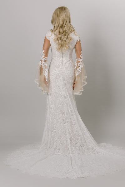 Back of fitted lace modest wedding dress. 