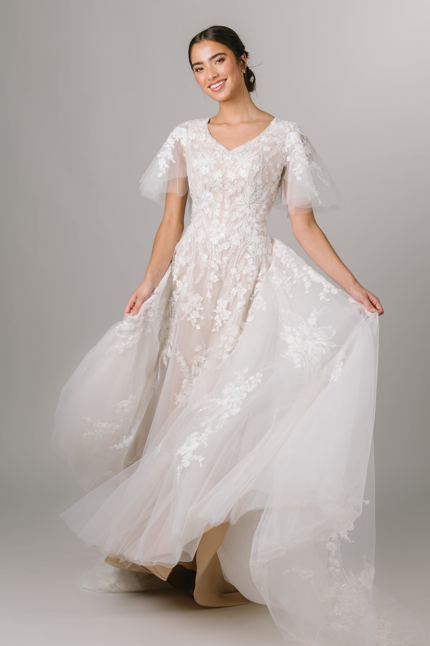 This Modest Dress features flutter sleeves, 3D lace appliques and an a soft ballgown fit. - Modest Wedding Dress - Modest Dresses - LDS Wedding Dress - LatterDayBride