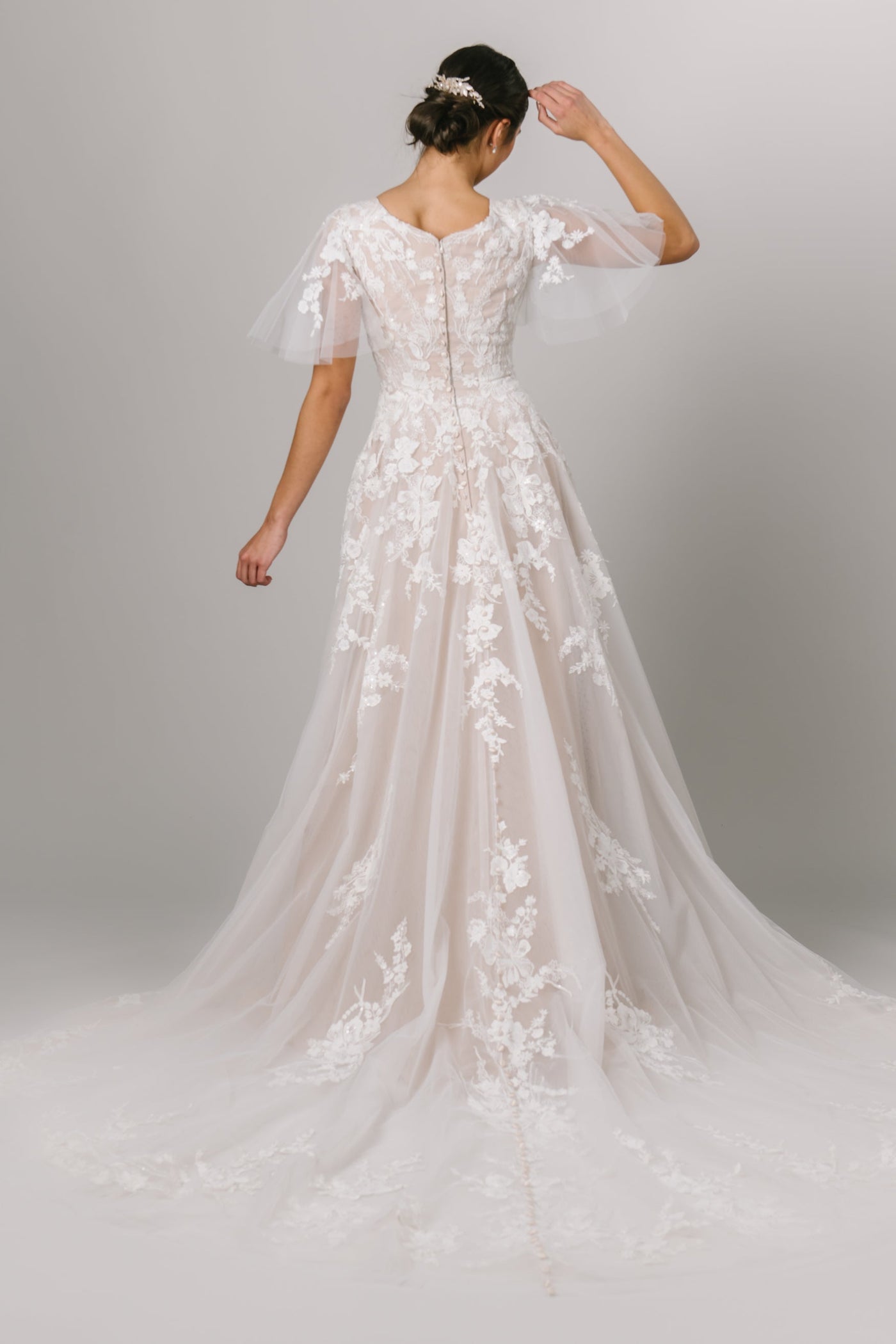This Modest Dress features flutter sleeves, 3D lace appliques and an a soft ballgown fit. - Modest Wedding Dress - Modest Dresses - LDS Wedding Dress - LatterDayBride