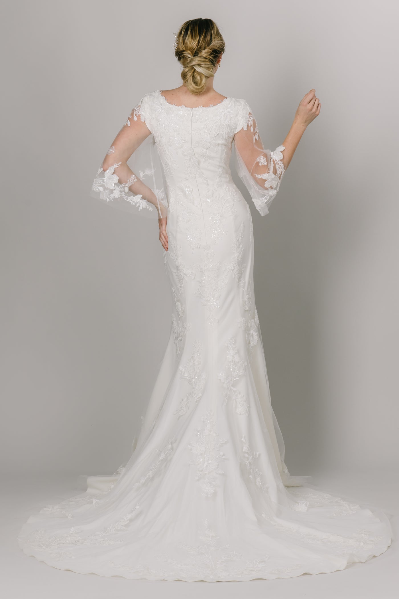 This Modest Wedding Dress features long flutter sleeves, and a fitted style. - Modest Wedding Dresses - Modest Clothing - Modest Dresses -Moments Made Bridal