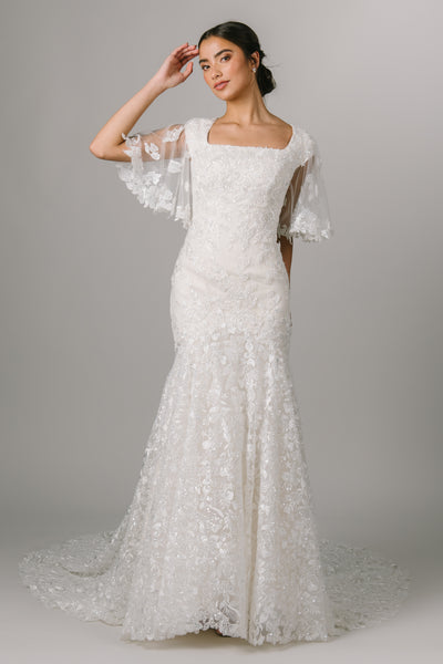 This Modest Wedding Dress features a square neckline, flutter sleeves and a beading throughout. - Modest Clothing - Modest Wedding Dresses - Modest Dresses - LatterDayBride