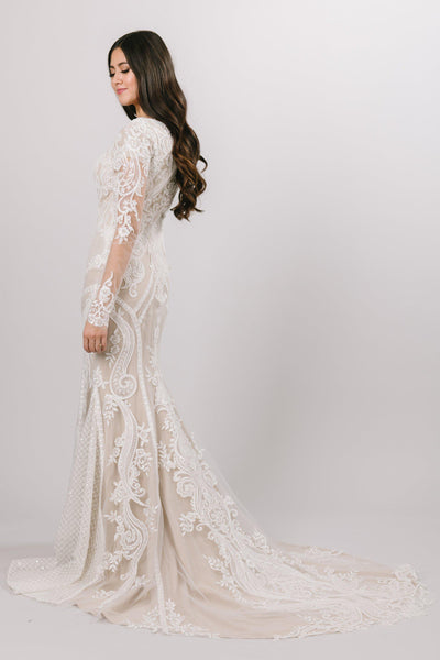 Modest wedding dress with geometric and basket-weave lace patterns that hug natural curves of the body at every angle.