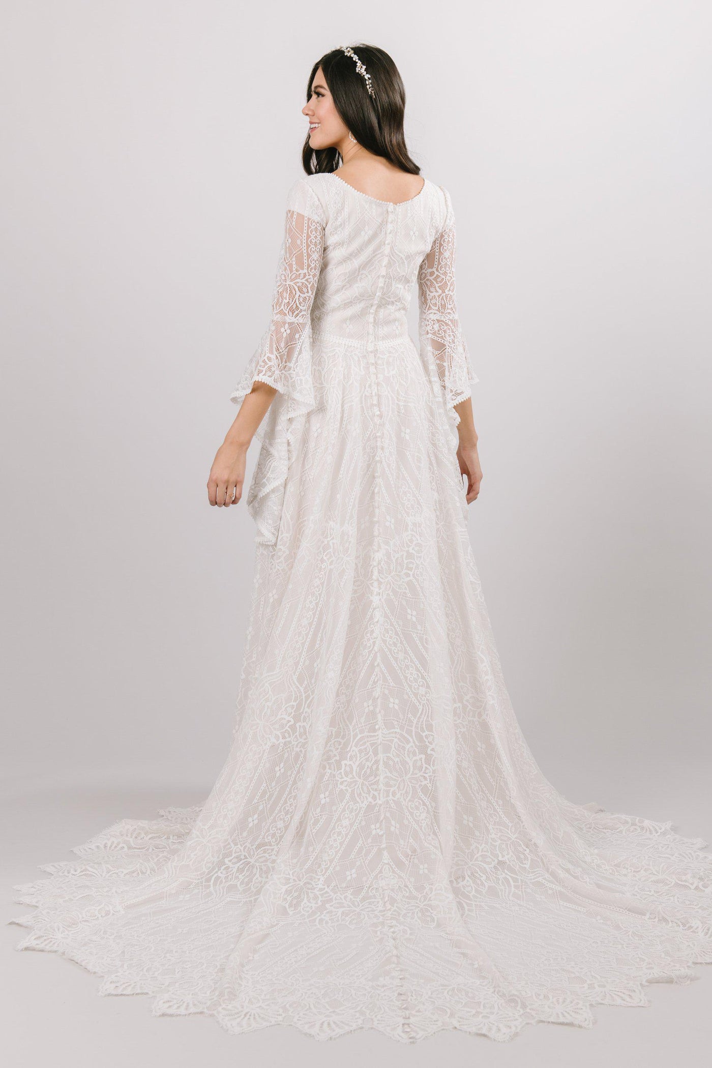 modest wedding dress Soft a-line laced dress with quarterly length flowing sleeves from salt lake city utah bridal shop