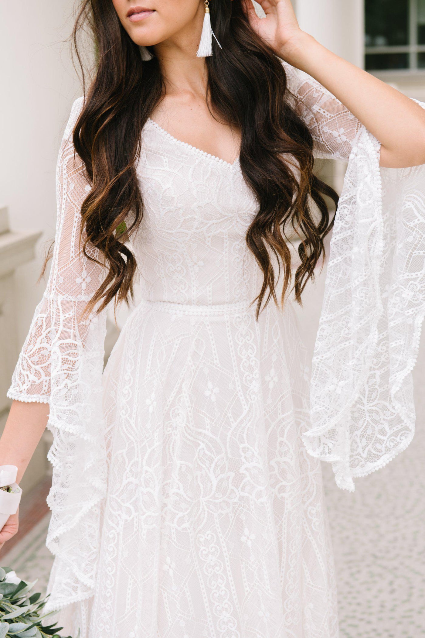 Modest wedding dress, Soft a-line laced dress with quarterly length flowing sleeves from salt lake city utah bridal shop