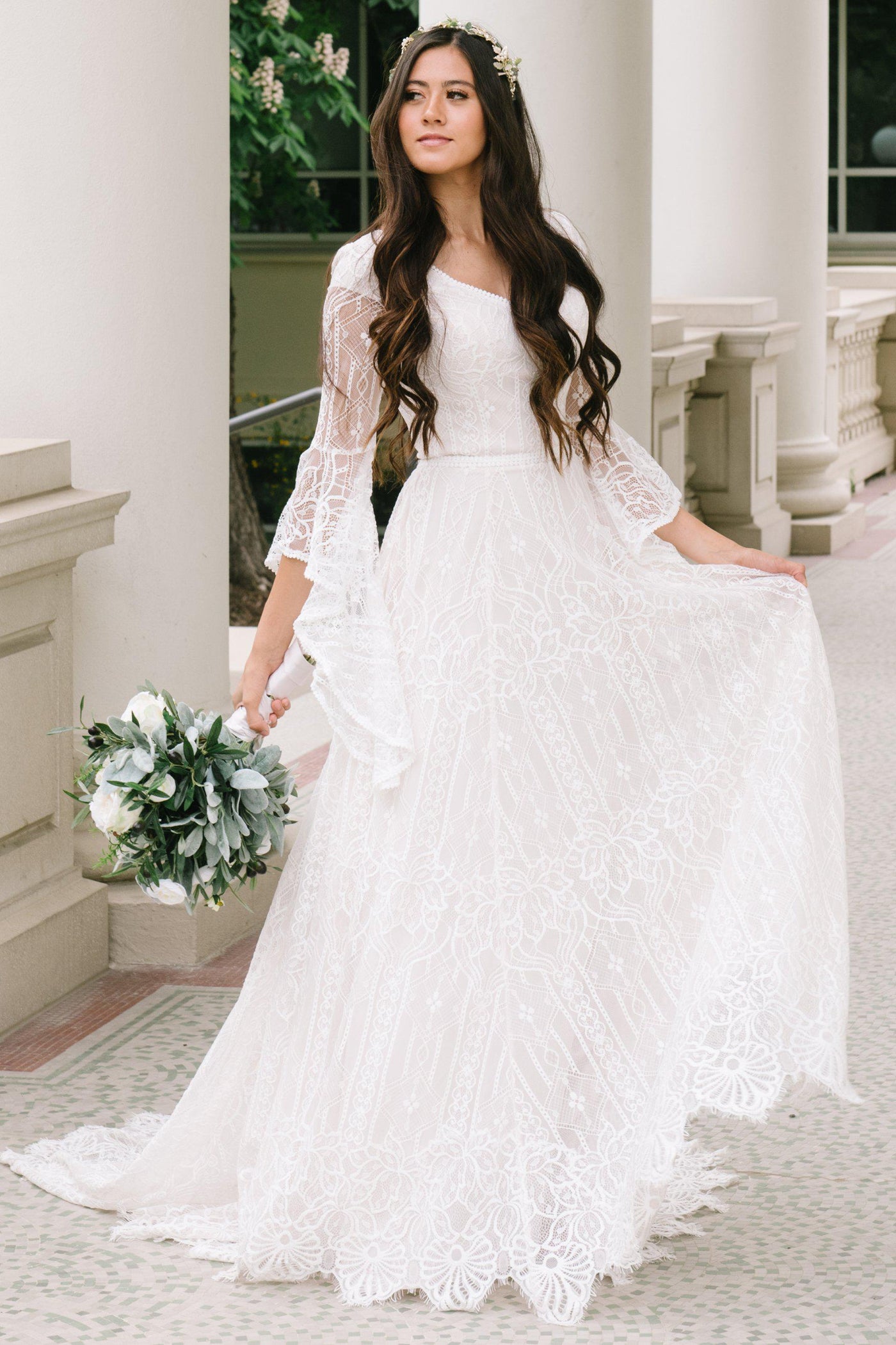 Modest wedding dress, Soft a-line laced dress with quarterly length flowing sleeves from salt lake city utah bridal shop