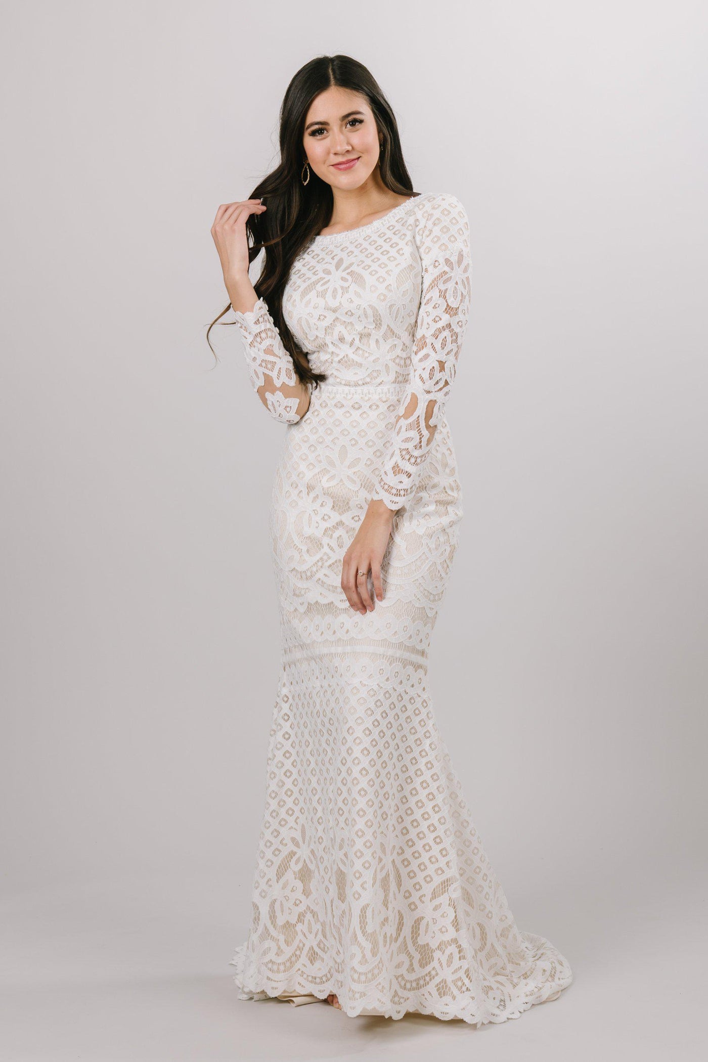Lace wedding gown with long sleeves, style Lorna, is part of the Wedding Collection of LatterDayBride, a Salt Lake City bridal shop.