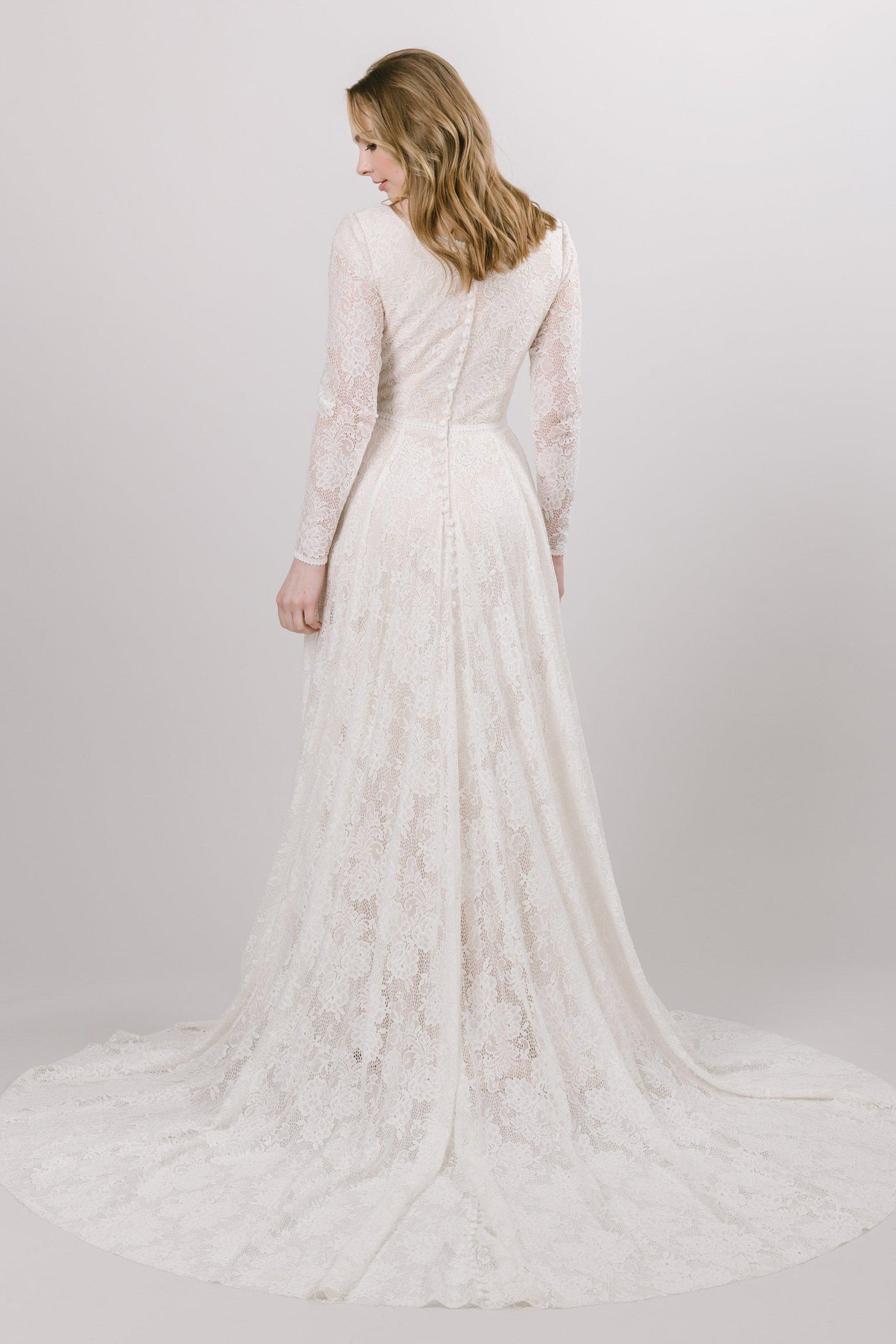 Modest Lace wedding dress with long, illusion laced sleeves from bridal shop in Salt lake city utah