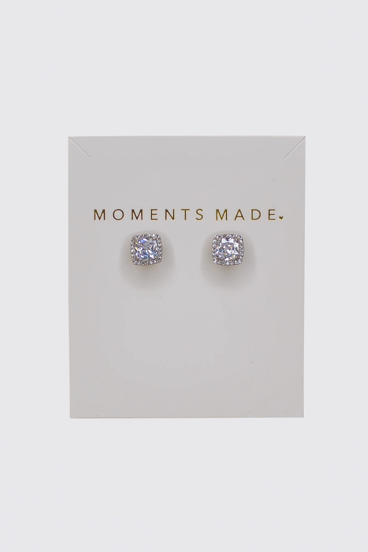 The earring is a cushion-cut crystal with a halo design.