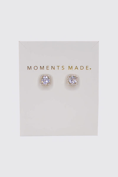 The earring is a cushion-cut crystal with a halo design. In Gold 