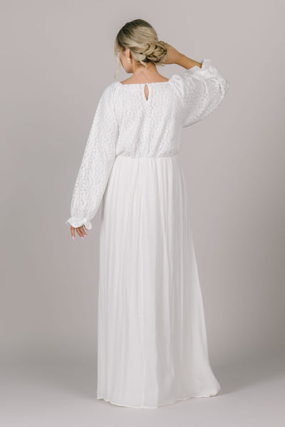 A beautiful modest LDS temple dress in Utah with a floral lace bodice and a keyhole in the back.