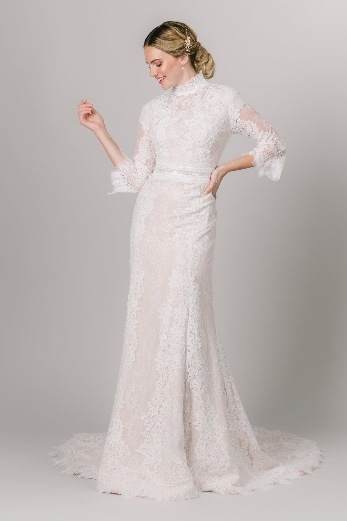 This Modest Wedding Dress features a high neckline, bell sleeves, and a fit and flare style. - Modest Clothing - Modest Dresses - Modest Wedding Dresses - LatterDayBride