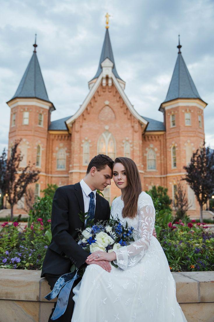 Real Bride wearing a long sleeve modest wedding dresses with embroidery and flowing skirt, the Lindir at LatterDayBride