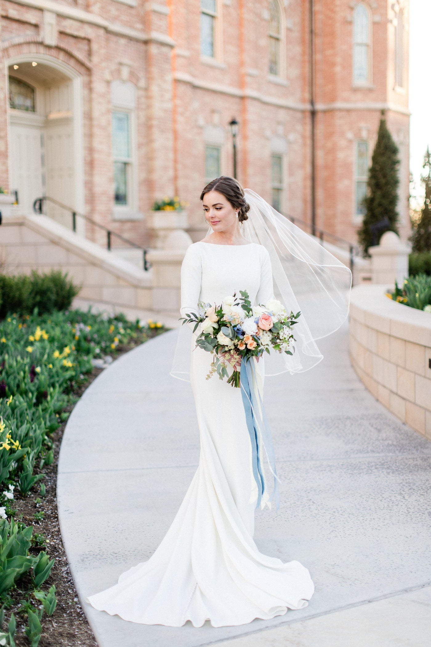 Real Bride wearing a Modest long sleeve bridal gown, style Markella, is part of the Wedding Collection of LatterDayBride, a Salt Lake City bridal shop.