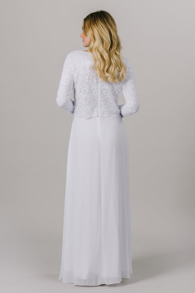 This LDS temple dress features a fully lined, loose lace bodice with a flattering waistband. It includes two pockets and a zipper close. From a bridal shop in downtown Salt Lake City.