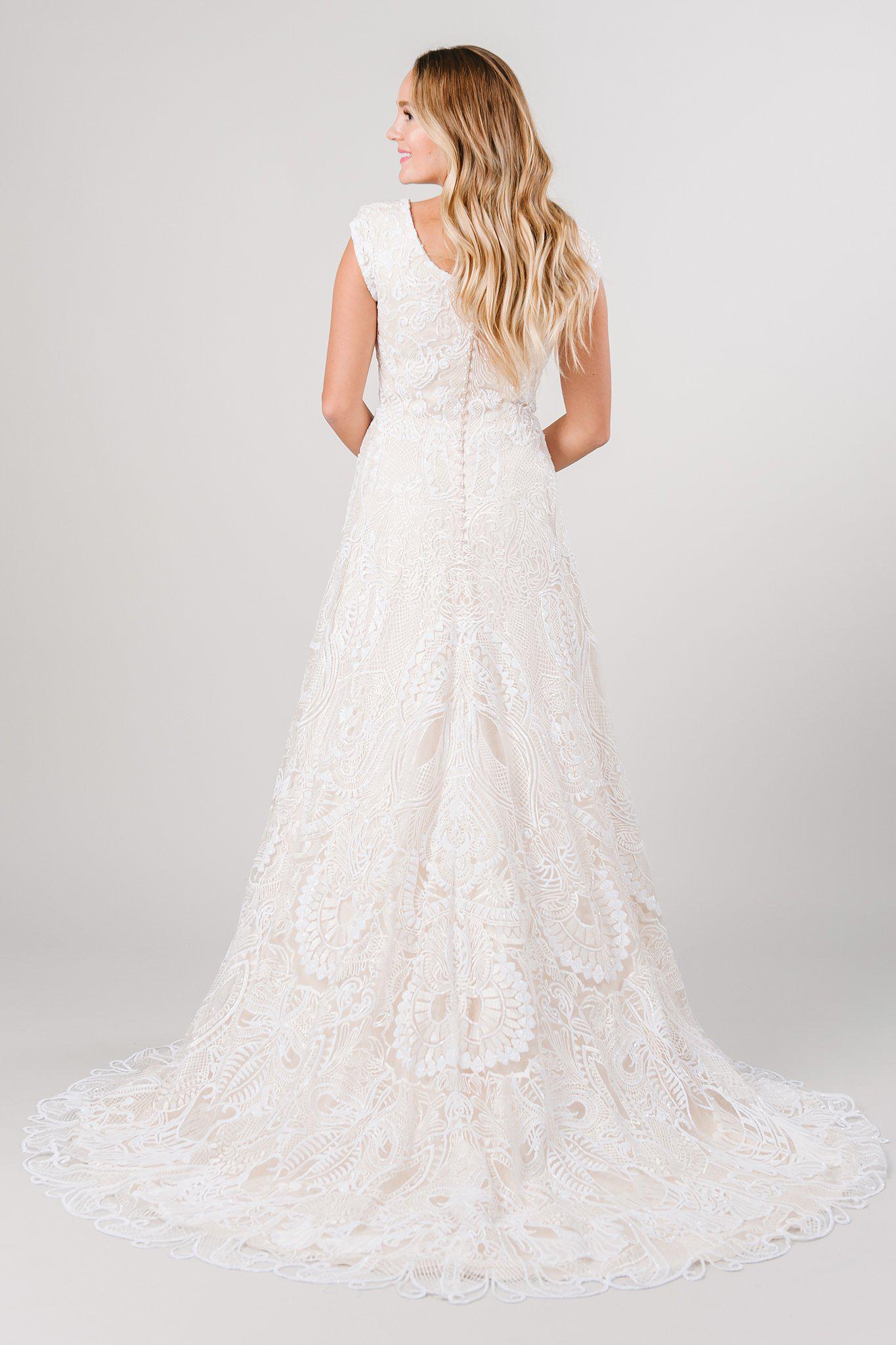 Back view of a modest wedding dress with full lace in a beautiful detailing! Modest wedding dress from LatterDayBride a bridal store in Salt Lake City, Utah. 