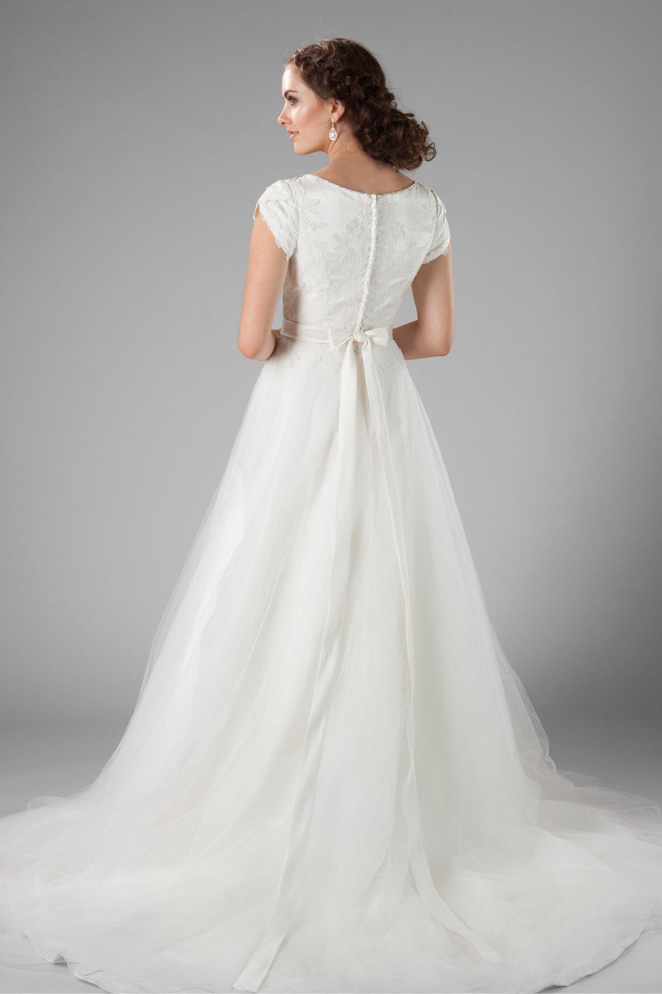The delicate petal sleeves, the wide boat neckline and the flattering cinched waist, modest wedding dresses salt lake, back view 