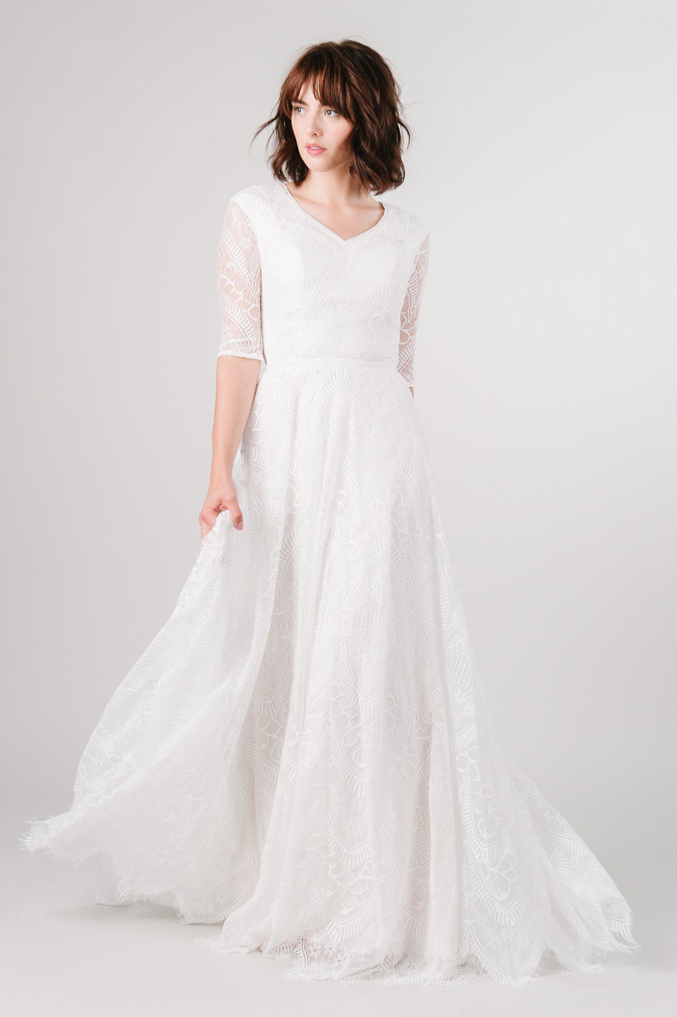 Modest lace wedding dress with long sleeves from LatterDayBride, a bridal shop in Downtown Salt Lake City, Utah. 