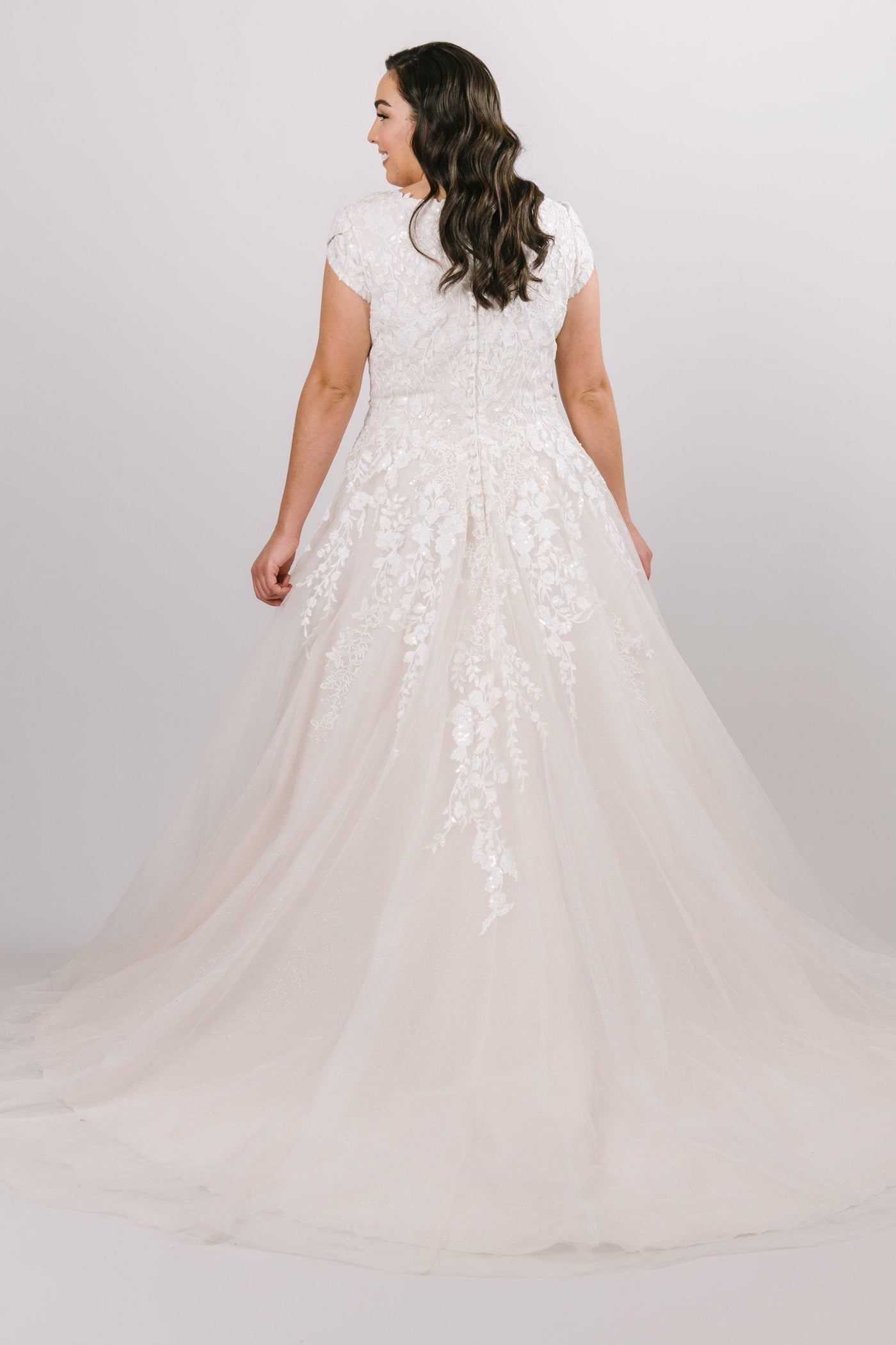 Modest ballgown with lace and sparkles from LatterDayBride, a modest wedding dress shop in Salt Lake City, Utah.