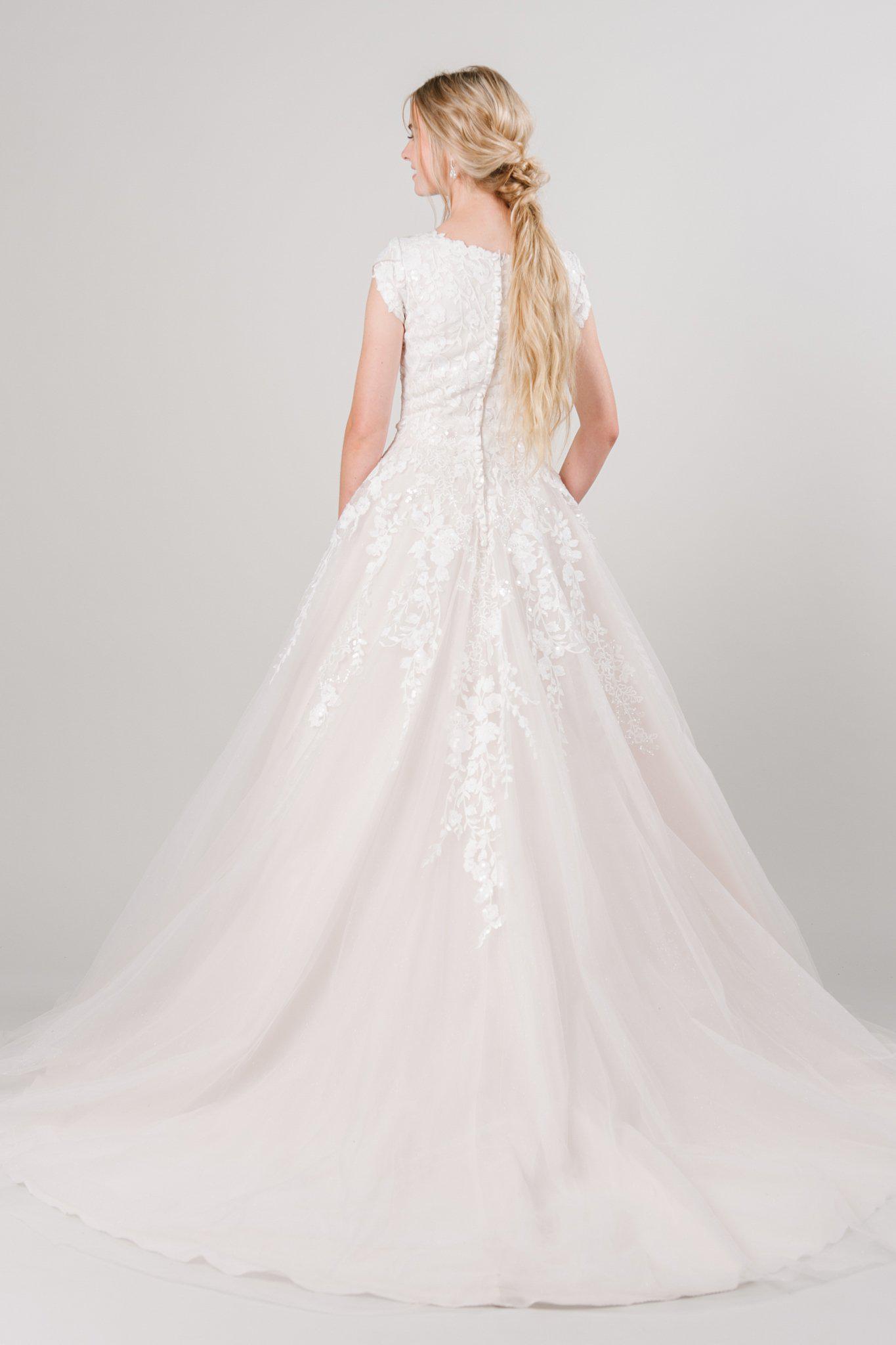 Modest ballgown with lace and sparkles from LatterDayBride, a modest wedding dress shop in Salt Lake City, Utah.
