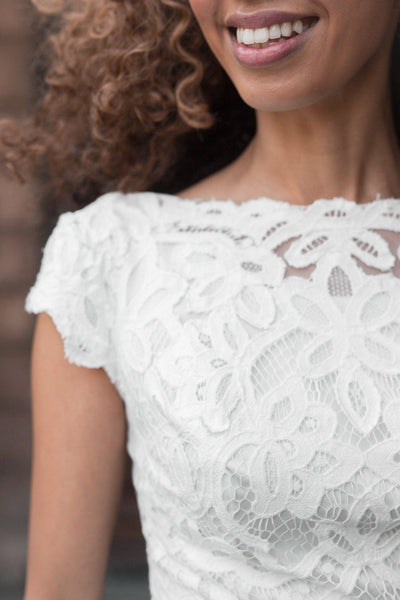 Close-up Boat neckline with delicate scalloped sleeves, style Luciana, is part of the Wedding Collection of LatterDayBride, a Salt Lake City bridal shop.