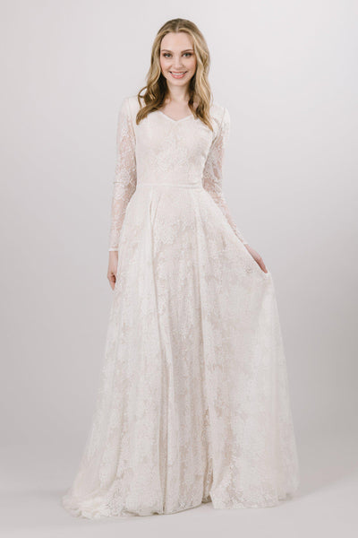 Modest Lace wedding dress with long, illusion laced sleeves from bridal shop in Salt lake city utah