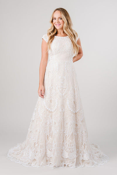 Modest wedding dress with full lace in a beautiful detailing! Modest wedding dress from LatterDayBride a bridal store in Salt Lake City, Utah. 