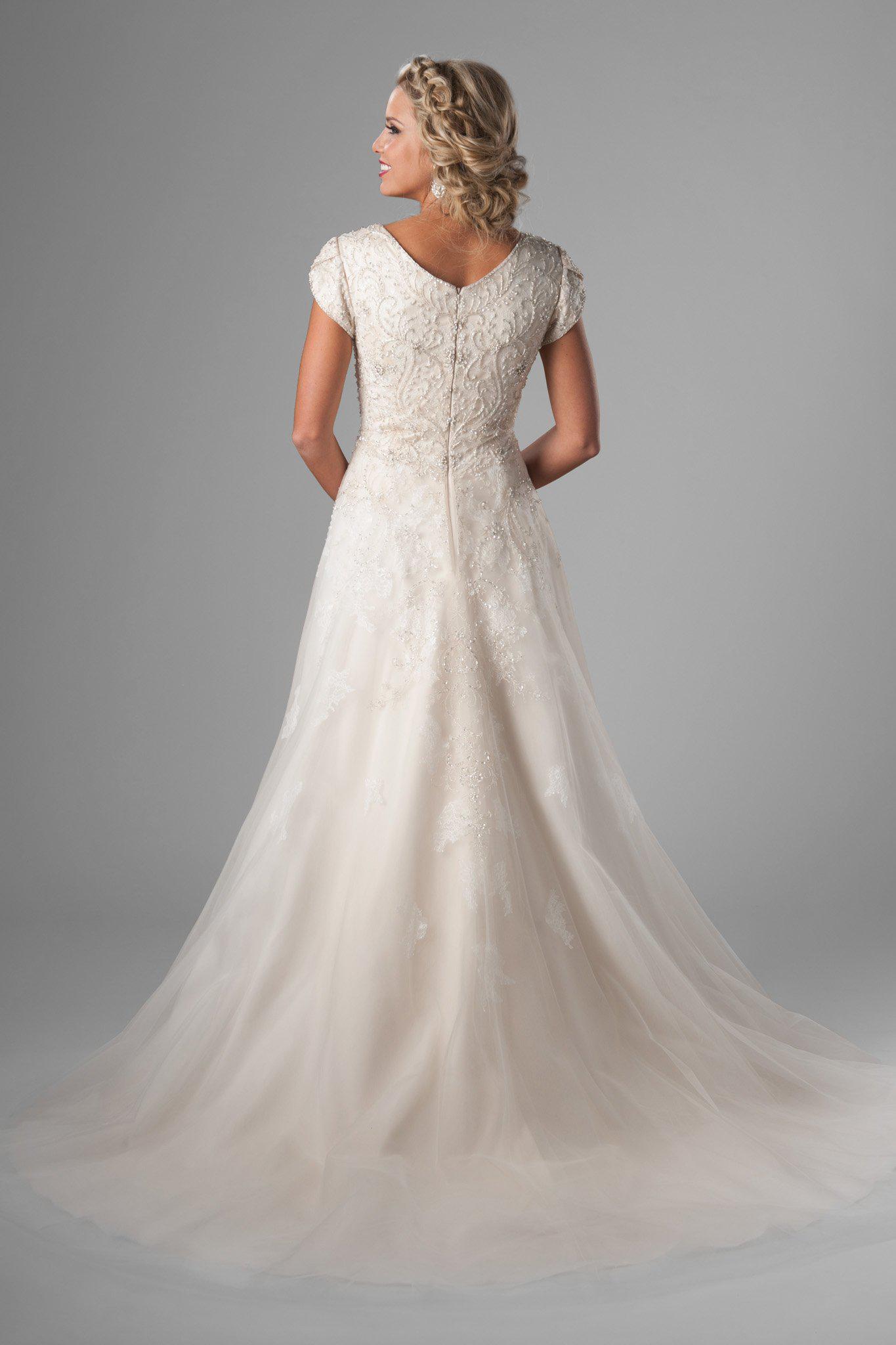 modest wedding gown. We love the bedazzled bodice, changing to soft flowing lace on the tulle skirt, salt lake city, back view