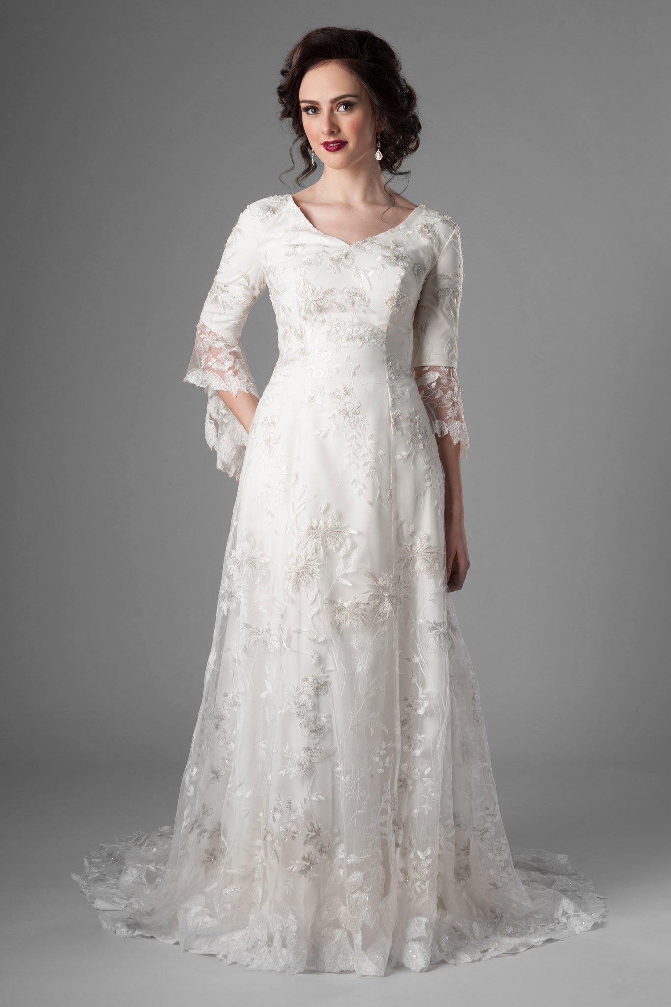 Fabulous florals with feminine shape modest wedding gown, style Rivendell, is part of the Wedding Collection of LatterDayBride, a Utah Wedding Shop. 