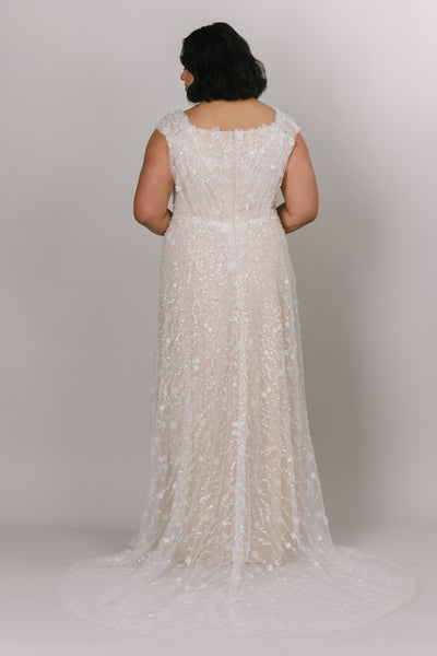 Modest wedding dress with the back view from a bridal shop called LatterDayBride.