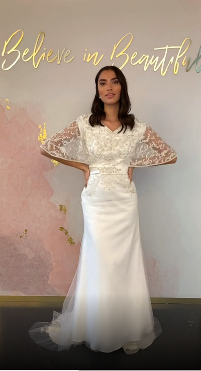 A video featuring our Primrose wedding dress and its beaded butterfly sleeves, waistline detailing, and elegant bodice.