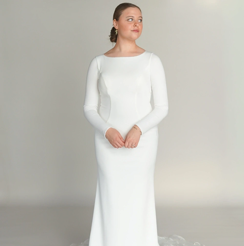 Model wearing an Modest Dresses $1000 - $1499 gown