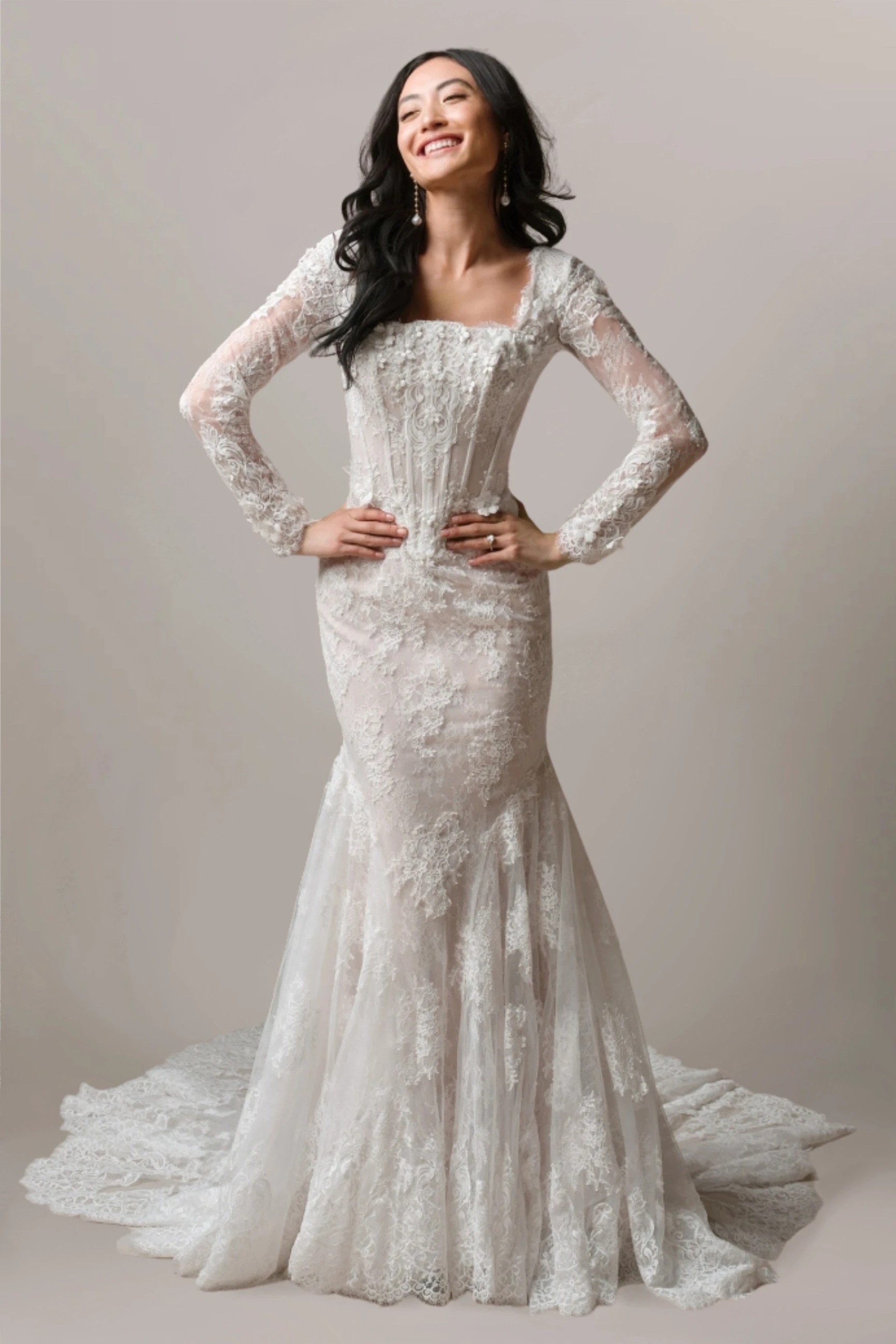 Model wearing an Modest Couture $2000+ gown