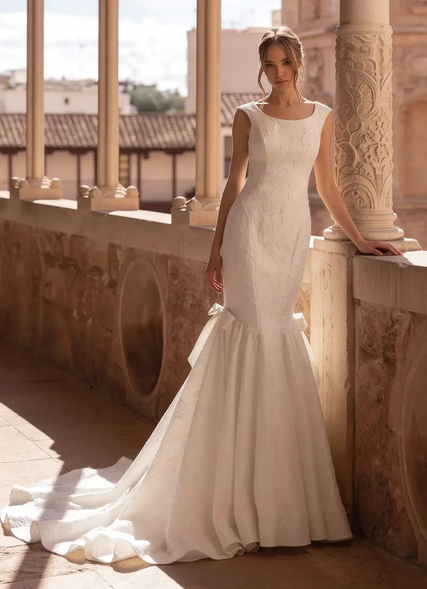 Model wearing a Fit-N-Flare gown