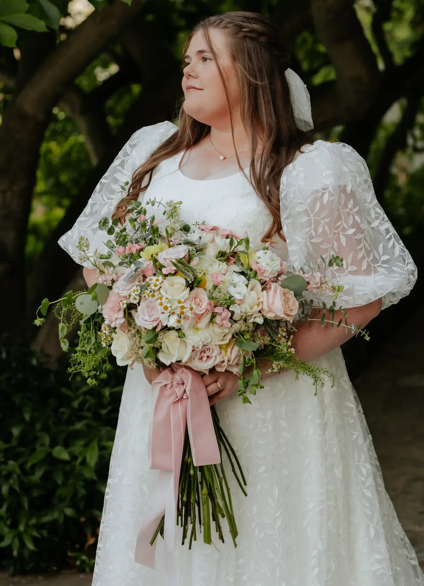Photo of the model wearing a white gown