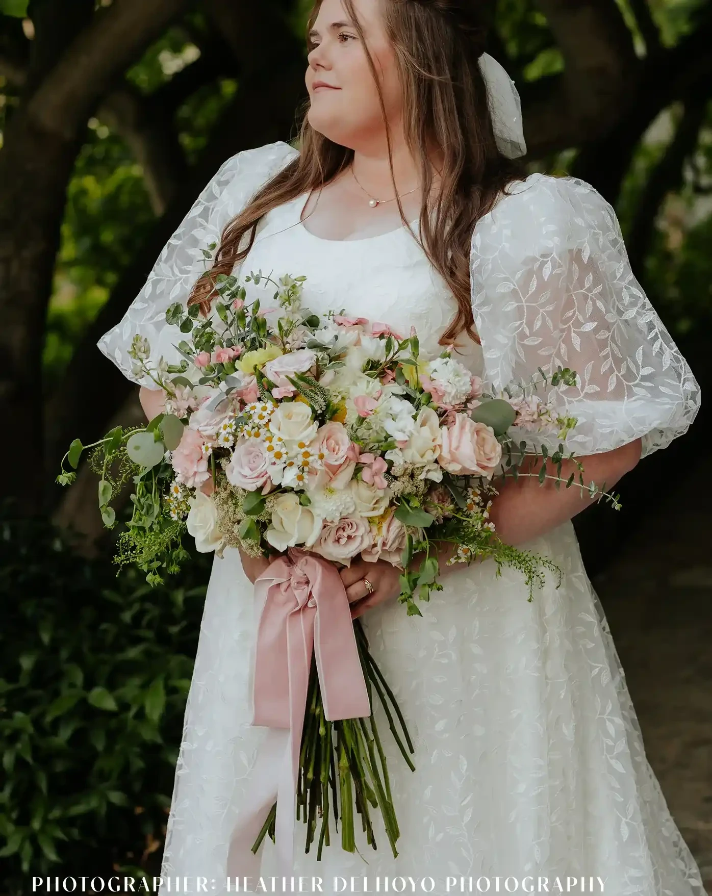 Photo of the model wearing a white gown