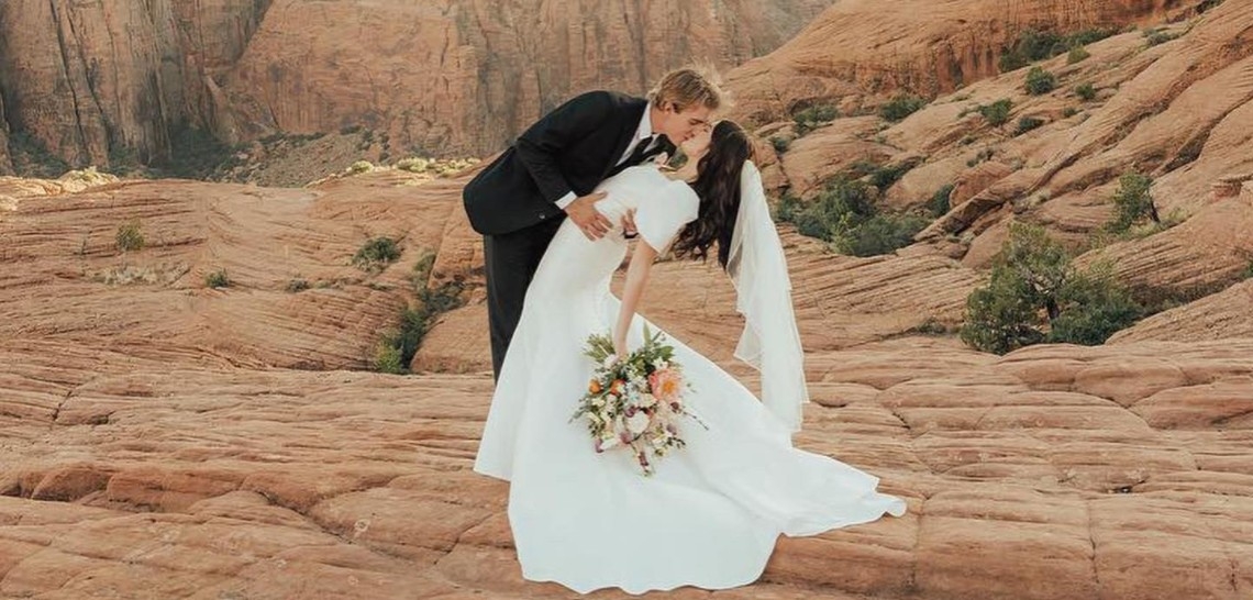 Photo of the kissing real bride and groom