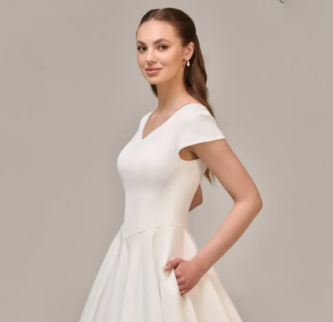 Model wearing an Modest Dresses $1000 - $1499 gown